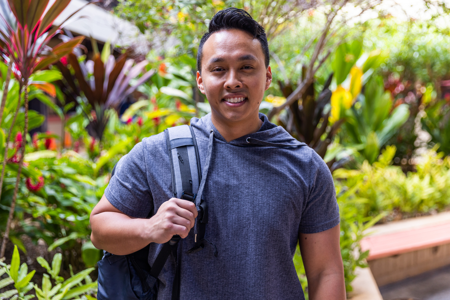 Student with backpack over one shoulder